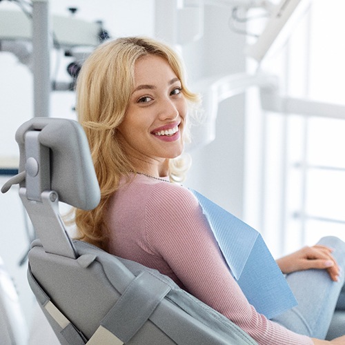 Closeup of smiling patient sitting in treatment chair