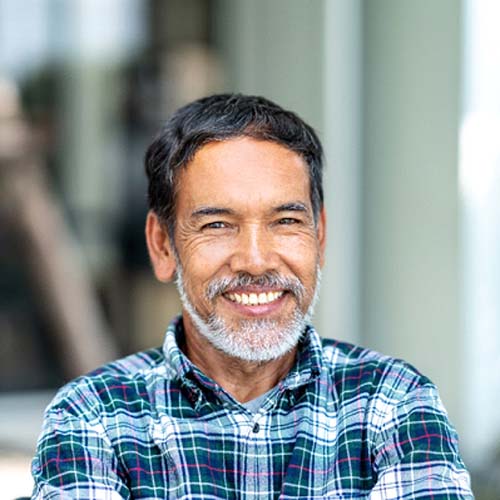 Man smiling with dental bridge in Dallas