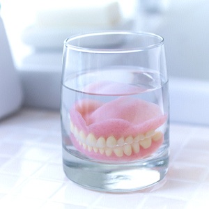 Dentures in Dallas soaking in solution