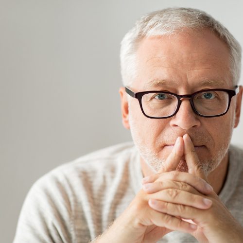 Man with glasses concentrating