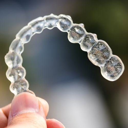 Closeup of clean, clear Invisalign in North Dallas aligners