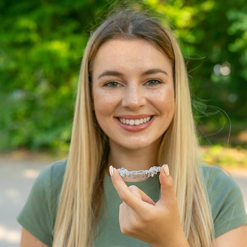 Clear Invisalign in North Dallas aligners on white background