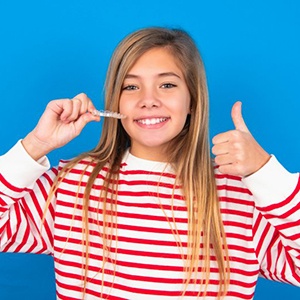 Teen gives thumbs-up for Invisalign