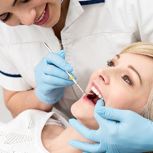 Woman receiving dental checkup