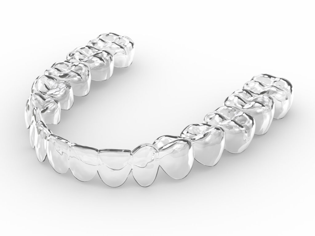 closeup of Invisalign aligner in Dallas