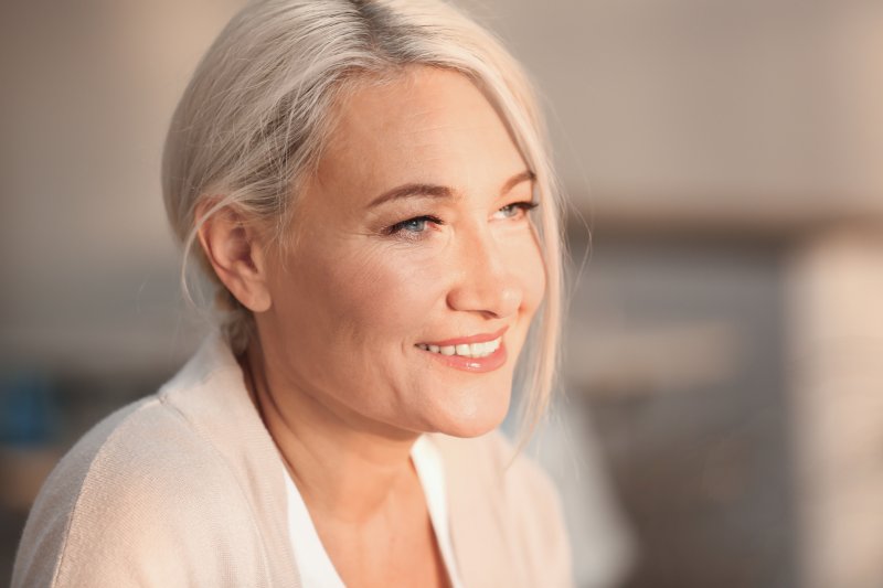 woman smiling with dentures in Dallas