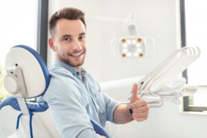 Man smiling at his emergency dental visit